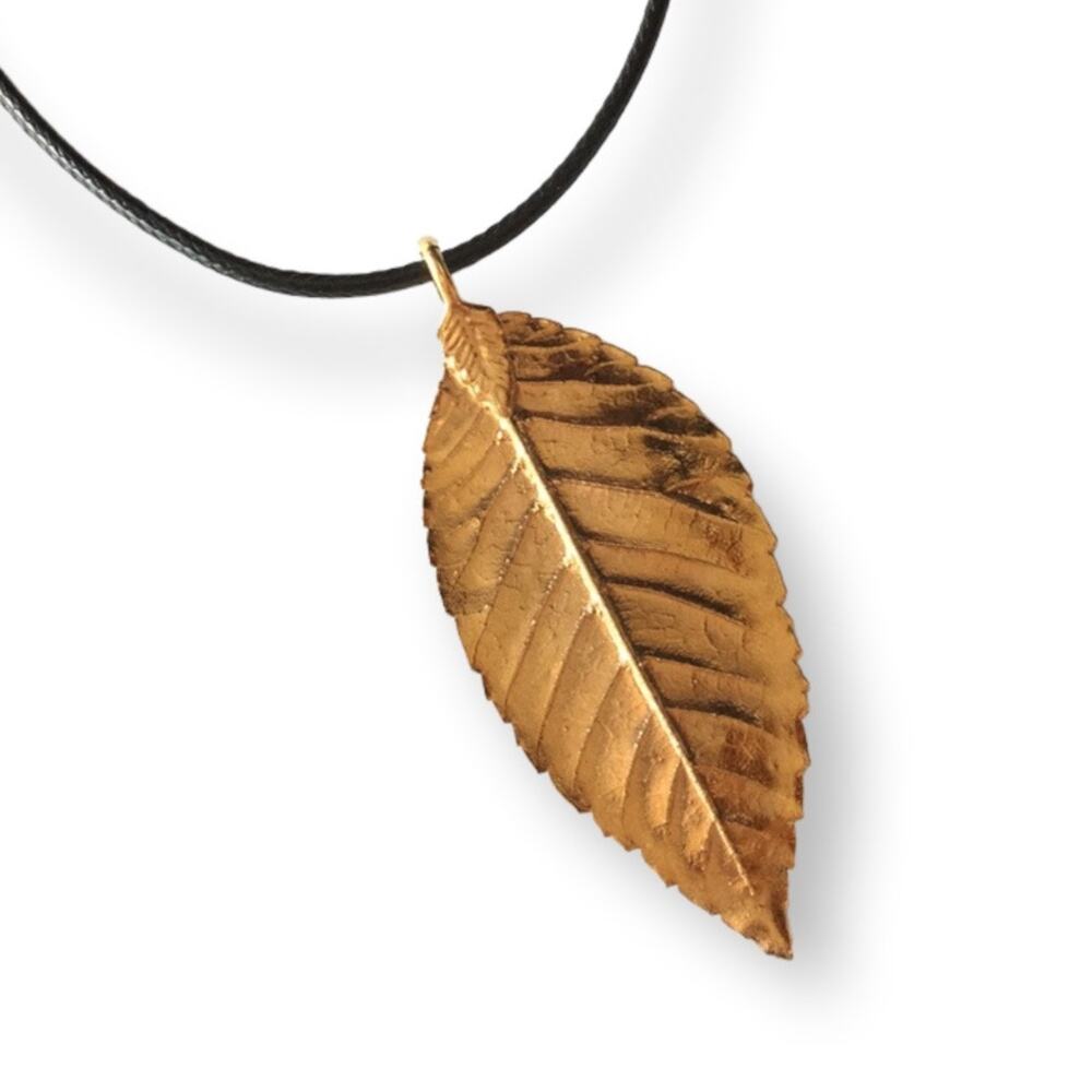 Golden leaf pendant necklace, waxed black cotton cord